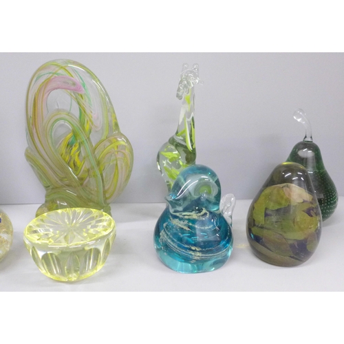 702 - A collection of glass paperweights including two Mdina birds, green glass flask and a Swaziland glas... 