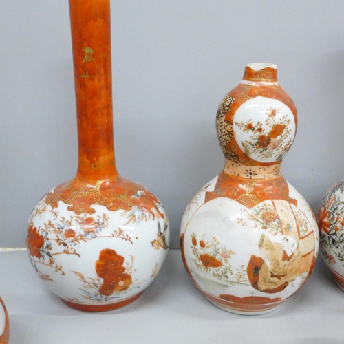 703 - A collection of nine Japanese Meiji period Kutani vases, two a/f