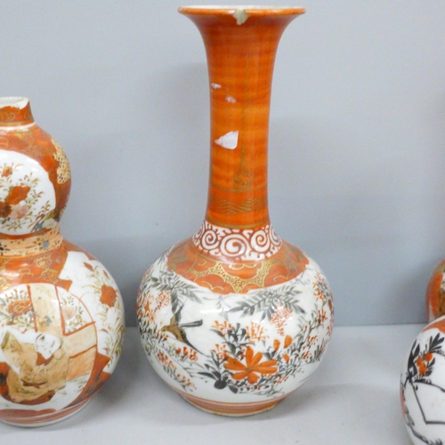 703 - A collection of nine Japanese Meiji period Kutani vases, two a/f