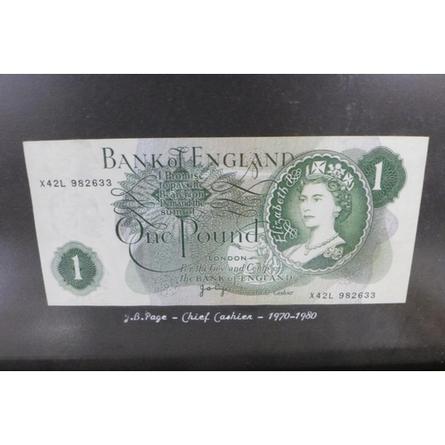 704 - Sixteen banknotes, £1 and 10 shillings, framed and mounted, Chief Cashiers include B G Catterns, K O... 