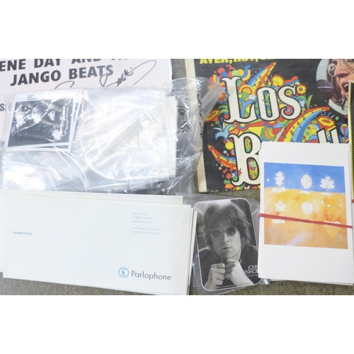 707 - A Beatles box of memorabilia including Yellow Submarine packs, gig poster signed Pete Best, clock, e... 