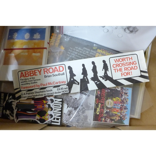 707 - A Beatles box of memorabilia including Yellow Submarine packs, gig poster signed Pete Best, clock, e... 