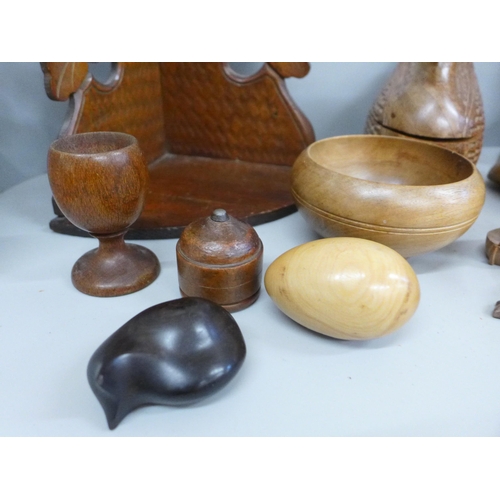 710 - A box of assorted treen; wall bracket, ink well, shoe trees, etc.