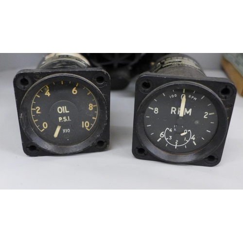 713 - Five aircraft gauges including Smiths RPM gauge and a smoke/gas mask