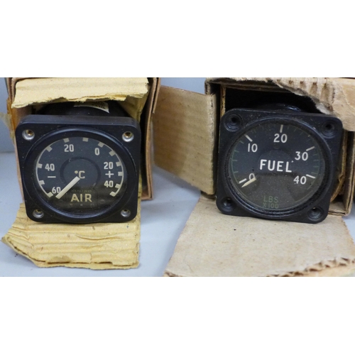 713 - Five aircraft gauges including Smiths RPM gauge and a smoke/gas mask