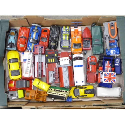 715 - Two boxes of model vehicles including cars, helicopters and lorries