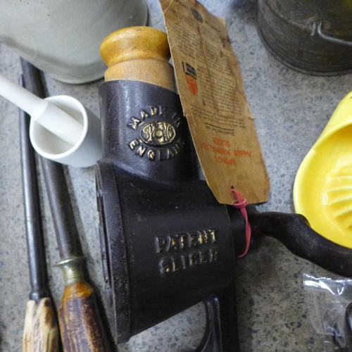 716 - A Spong marmalade slicer, a Goebel juicer, a Bee flour sifter, caddy spoons and other kitchenalia