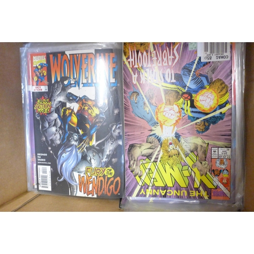 728 - A collection of Wolverine, X-men and other Marvel comics, majority 1990s, (150+) and a model Wolveri... 