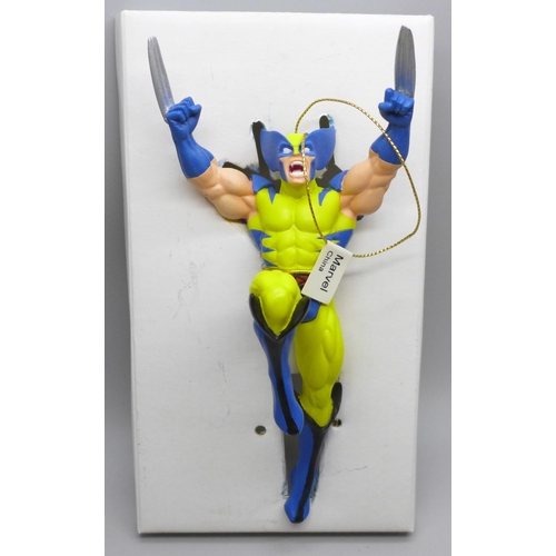 728 - A collection of Wolverine, X-men and other Marvel comics, majority 1990s, (150+) and a model Wolveri... 