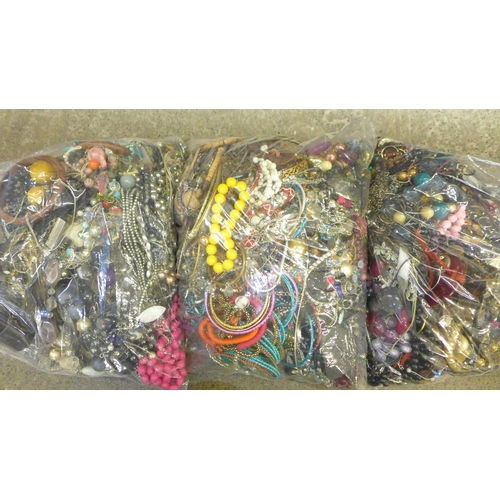 729 - Three large bags of costume jewellery