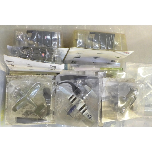 736 - A large box of assorted model aircraft in sealed packets