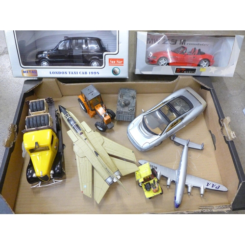 760 - A Sun Star TX1 London taxi cab 1998, a UT model BMW and a collection of other toys including aircraf... 