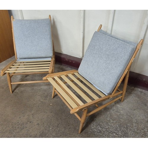 16 - A pair of Ercol Blonde beech 427 model easy chairs