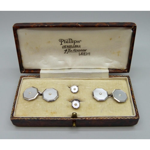 904 - A silver, 9ct white gold and pearl cufflink and stud set, cased, (9ct white gold front/rim)