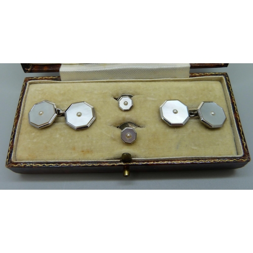 904 - A silver, 9ct white gold and pearl cufflink and stud set, cased, (9ct white gold front/rim)