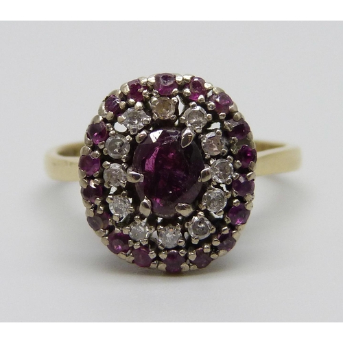 906 - An 18ct gold, ruby and diamond cluster ring, 5.5g, P