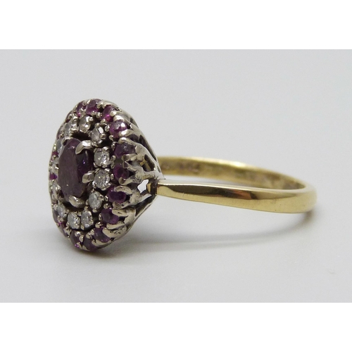 906 - An 18ct gold, ruby and diamond cluster ring, 5.5g, P