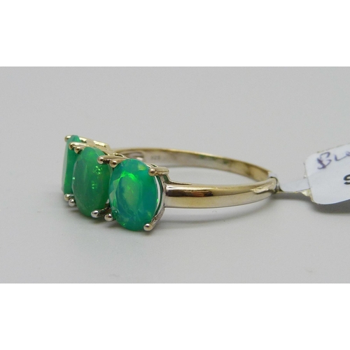 909 - A silver gilt blue opal ring, U