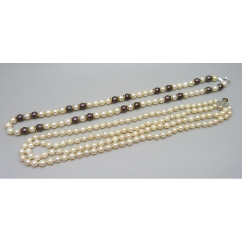 916 - A two colour pearl necklace and two strand pearl necklace, silver clasps