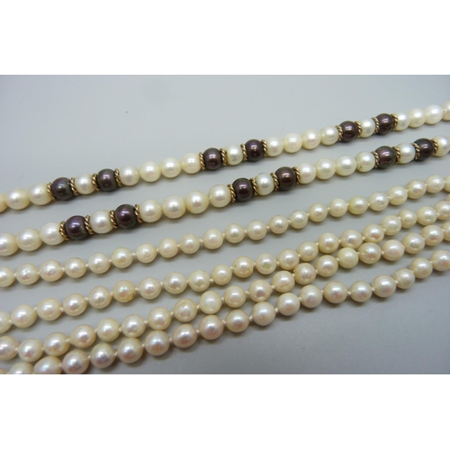 916 - A two colour pearl necklace and two strand pearl necklace, silver clasps