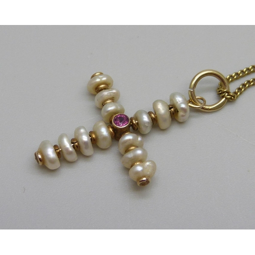 923 - A 9ct gold and pearl cross pendant on a 14ct gold chain, total weight 3.7g, (chain 2.2g), chain 44cm