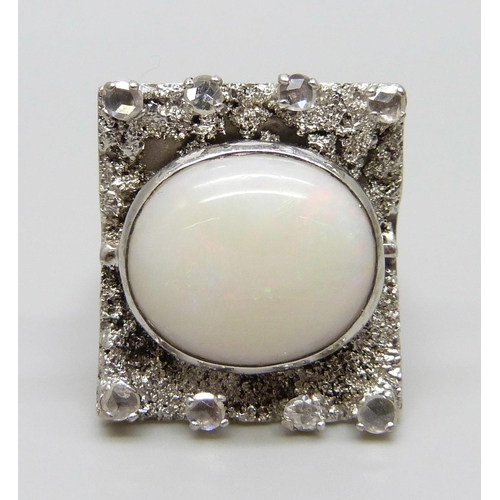 927 - A 9ct white gold Brutalist style ring set with eight old cut diamonds and a large opal, Birmingham 1... 