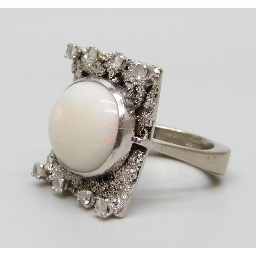 927 - A 9ct white gold Brutalist style ring set with eight old cut diamonds and a large opal, Birmingham 1... 