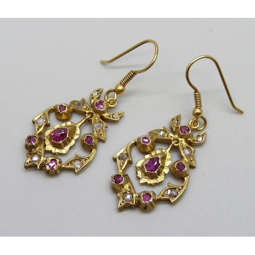 929 - A pair of Victorian gilt metal drop earrings set with old cut diamonds and rubies, replacement hooks