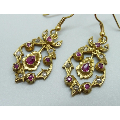 929 - A pair of Victorian gilt metal drop earrings set with old cut diamonds and rubies, replacement hooks