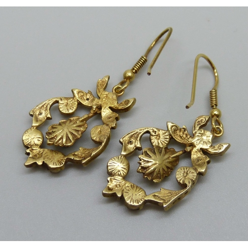 929 - A pair of Victorian gilt metal drop earrings set with old cut diamonds and rubies, replacement hooks