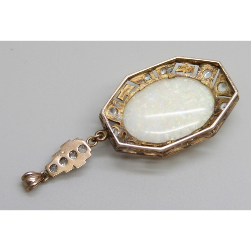 931 - An Art Deco yellow metal drop pendant set with white stones and a large opal, opal 16mm x 24mm, 8g