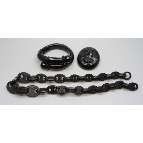 940 - A Victorian carved jet mariner link chain, a jet bracelet and a jet cameo brooch