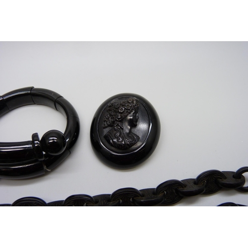 940 - A Victorian carved jet mariner link chain, a jet bracelet and a jet cameo brooch