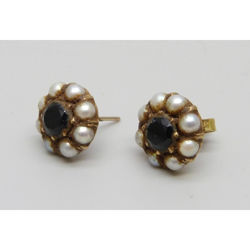 941 - A pair of yellow metal, seed pearl and sapphire stud earrings, one lacking butterfly, 3.3g