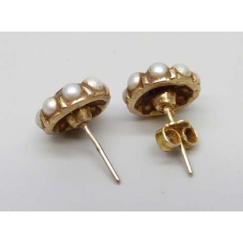 941 - A pair of yellow metal, seed pearl and sapphire stud earrings, one lacking butterfly, 3.3g