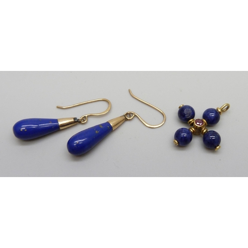 943 - A pair of lapis lazuli earrings on yellow metal hooks and a yellow metal lapis and ruby pendant