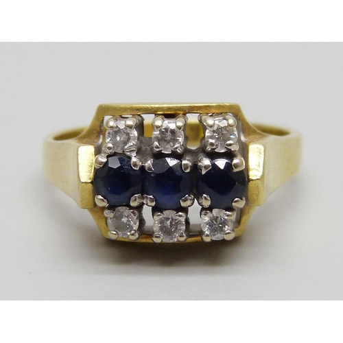 947 - An 18ct gold ring set with six diamonds and three sapphires, 7g, N/O