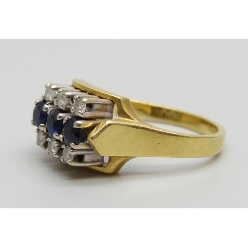 947 - An 18ct gold ring set with six diamonds and three sapphires, 7g, N/O