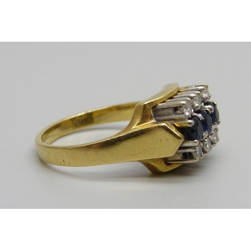 947 - An 18ct gold ring set with six diamonds and three sapphires, 7g, N/O