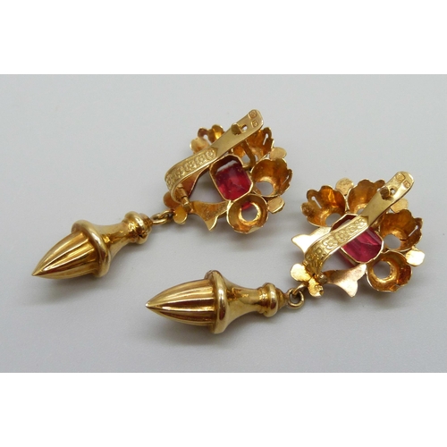 950 - A pair of yellow metal drop earrings set with red stones, with continental control marks, possibly G... 