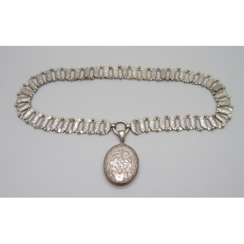 954 - A Victorian white metal collar necklace with a Victorian locket pendant