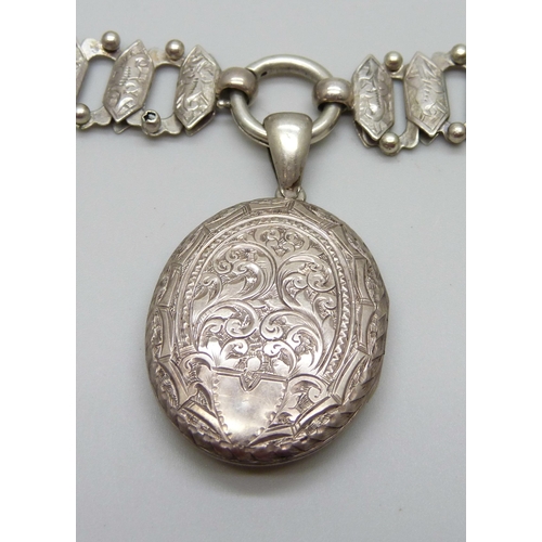 954 - A Victorian white metal collar necklace with a Victorian locket pendant