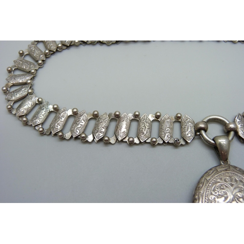 954 - A Victorian white metal collar necklace with a Victorian locket pendant