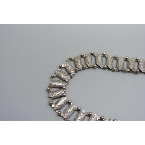 954 - A Victorian white metal collar necklace with a Victorian locket pendant