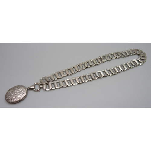 954 - A Victorian white metal collar necklace with a Victorian locket pendant