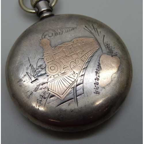 963 - A silver cased Waltham top-wind railway pocket watch, the case back with US locomotive detail in gol... 