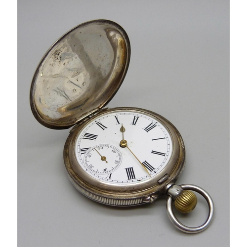 965 - A silver full-hunter top-wind pocket watch, marked 0.935, lacking glass