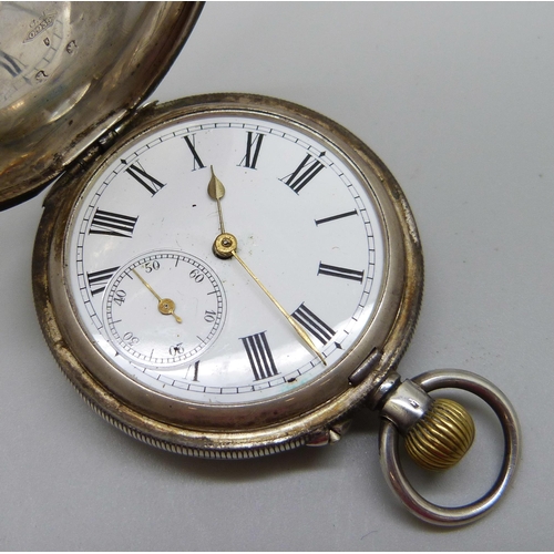 965 - A silver full-hunter top-wind pocket watch, marked 0.935, lacking glass