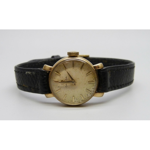 970 - A lady's 9ct cased Omega wristwatch on an Omega strap, (replacement crown, not Omega)