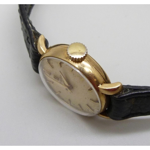 970 - A lady's 9ct cased Omega wristwatch on an Omega strap, (replacement crown, not Omega)